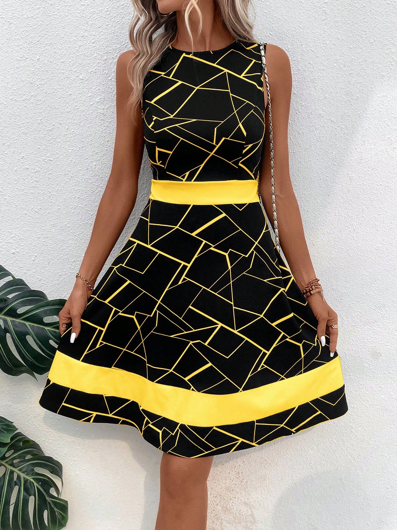Effortlessly elevate your style with our Chic Geo Print A-Line Dress in Classic Black. The versatile A-line silhouette and modern geo print make for a timeless combination that will turn heads. Embrace effortless elegance with this must-have dress.