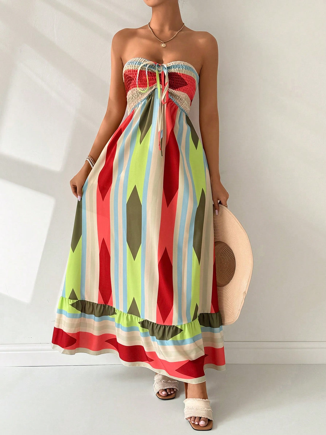 Get ready to slay on your next summer vacation or beach day with our Chic Geometric Bandeau Maxi Dress! This trendy dress is not only stylish with its geometric print, but also functional, keeping you cool and comfortable during those hot summer days. Perfect for any occasion, this dress is a must-have for your wardrobe.