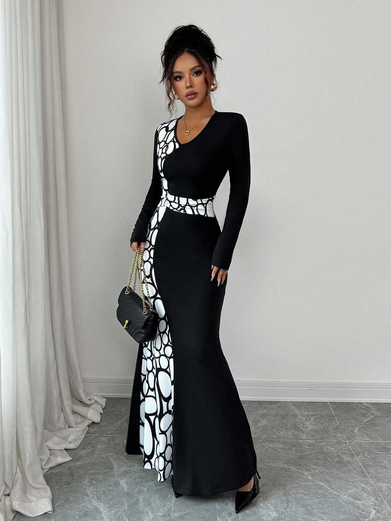 Turn heads in this stunning geometric print maxi dress that effortlessly transitions from casual coffee dates to evening celebrations. The flattering V-neck and bold color-block design create a modern silhouette that's equal parts chic and comfortable. Whether you're dressing up for a night out or keeping it relaxed on the weekend, this versatile piece proves that style doesn't have to be complicated. Perfect for anyone who loves making a statement without trying too hard.