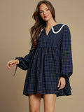 Gingham meets girly in this adorable babydoll mini dress that's giving major country concert vibes. The crisp eyelet detailing and charming collar add preppy polish, while the flowy silhouette keeps things breezy and fun. Whether you're dancing in the dirt or grabbing coffee with friends, this fall essential pairs perfectly with boots, sneakers, or sandals. It's the dress that makes you feel effortlessly cute without even trying.