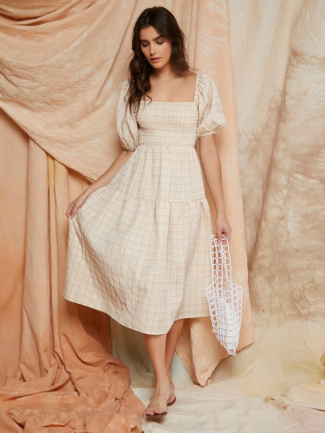 Effortlessly style any occasion with our Chic Gingham Puff Sleeve Dress! This dress features a charming gingham print and playful puff sleeves. Perfect for those looking for a fun and quirky statement piece in their wardrobe. Say goodbye to boring dresses and hello to effortless style!