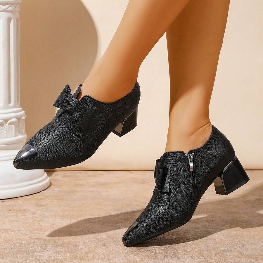 Elevate your style with these stunning glossy pointed high heels featuring an adorable bow detail. Crafted from premium PU leather, these slip-on beauties combine elegance with everyday comfort thanks to their chunky heel design. Perfect for parties, date nights, or any occasion that calls for a touch of sophistication. The sleek black finish and eye-catching bow accent make them a versatile addition to any fashion-forward wardrobe. Step out with confidence and turn heads wherever you go.