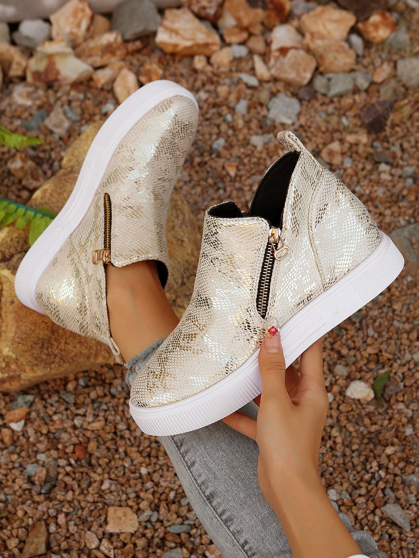 Add a touch of style to your winter wardrobe with our Chic Gold Ankle Boots for Women. These stylish booties feature a convenient zip-up design, making it easy to slip them on and off. The sleek gold color will elevate any outfit, while keeping your feet warm and comfortable.