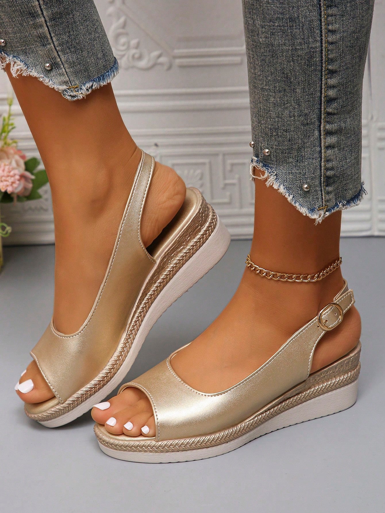 Get ready to strut in style this summer with our Chic Gold Peep-Toe Wedge Sandals! These stylish kicks are a must-have for any fashionable mom looking to elevate her summer footwear game. With its sleek design and comfortable wedge heel, you'll be the envy of all the other moms on the block. Perfect for any occasion, from backyard BBQs to a day at the beach. Don't miss out on these must-have sandals!