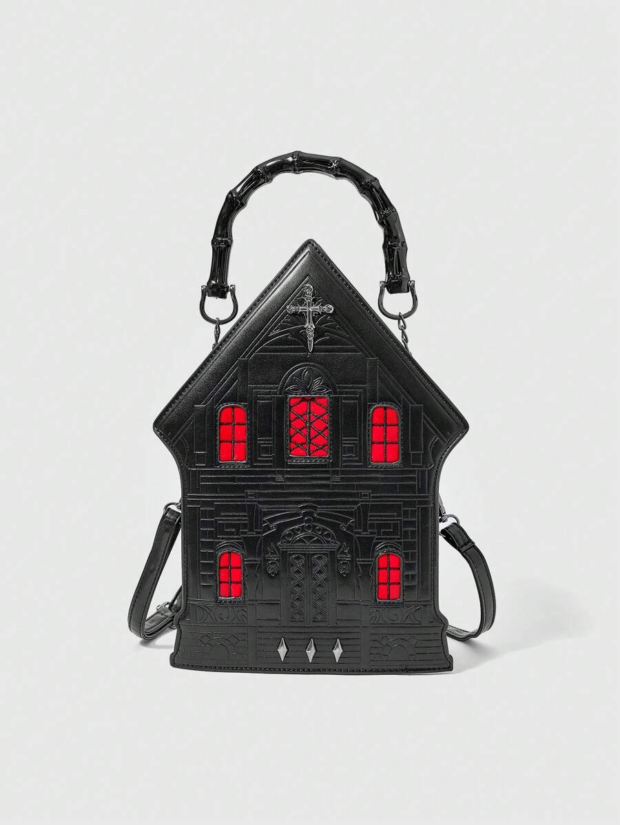 Front view of black gothic castle-shaped handbag with red windows, embossed doorway and glossy top handle