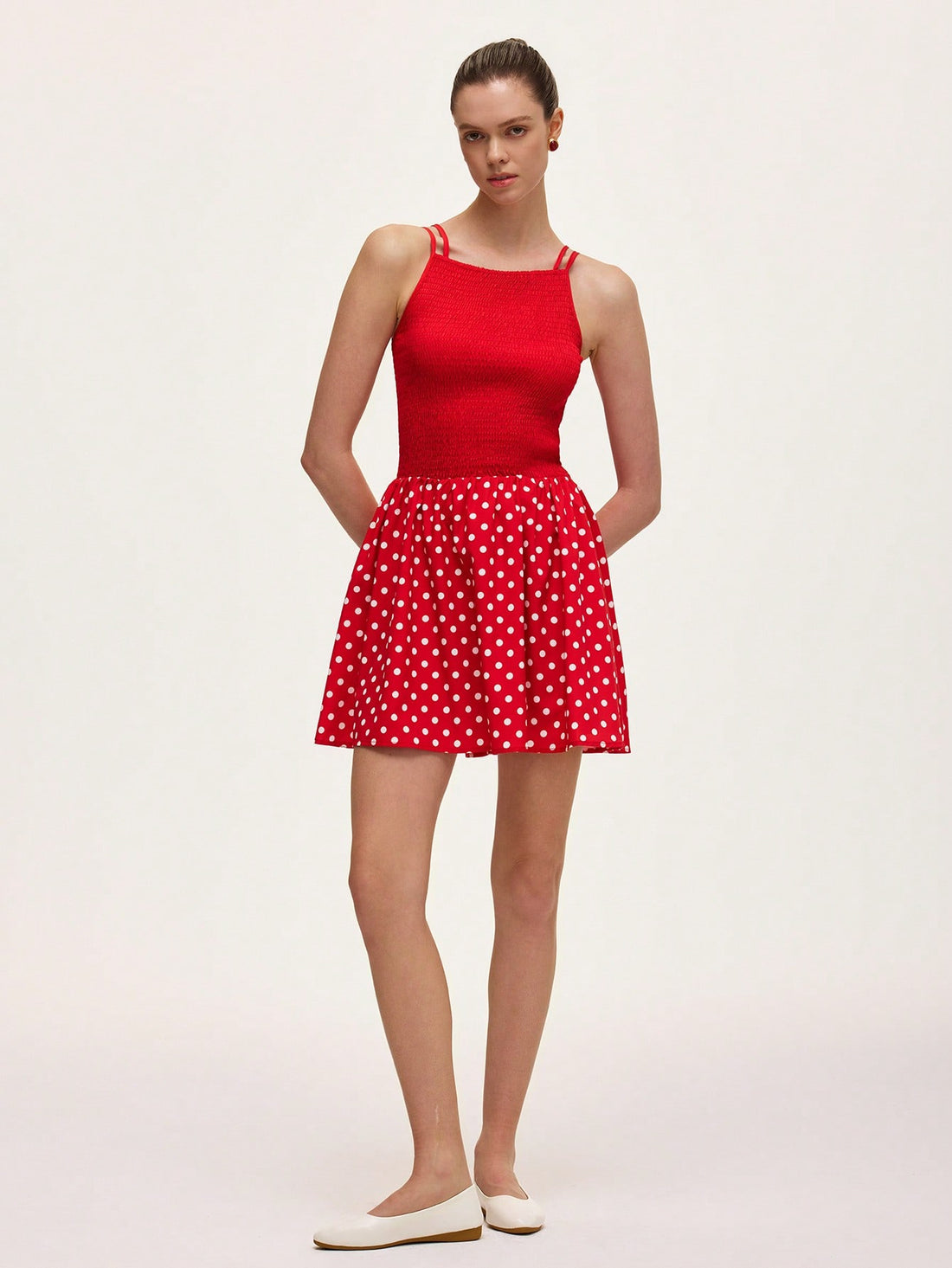 Step into summer with this playful green and red polka dot cami dress. The ruched detailing adds a flirty touch, while the lightweight fabric keeps you cool and comfortable. Perfect for sunny days and stylish nights, this dress brings fun and flair to your warm-weather wardrobe.