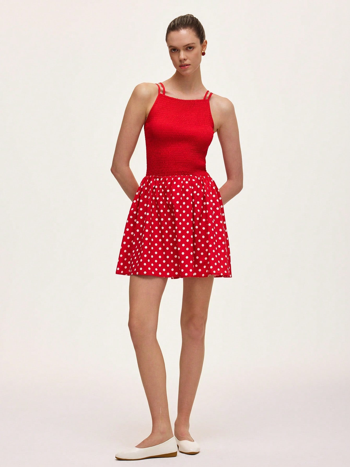 Step into summer with this playful green and red polka dot cami dress. The ruched detailing adds a flirty touch, while the lightweight fabric keeps you cool and comfortable. Perfect for sunny days and stylish nights, this dress brings fun and flair to your warm-weather wardrobe.
