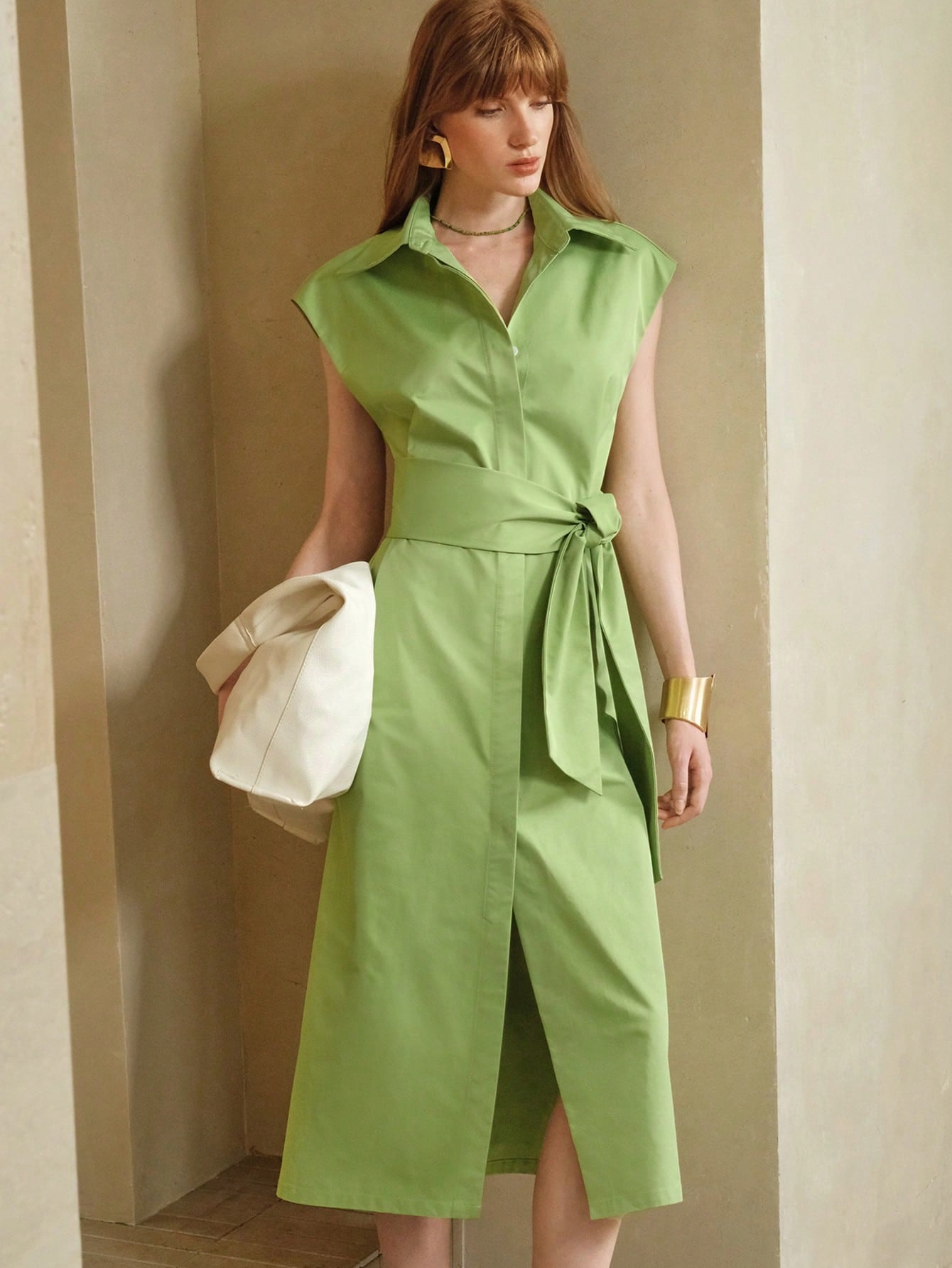 Step into summer with this playful green midi dress featuring wide shoulders and a flattering belted waist. Perfectly balancing work-ready polish and casual charm, it’s your go-to for sunny days and stylish meetings alike. Embrace comfort and confidence wherever you wear it!