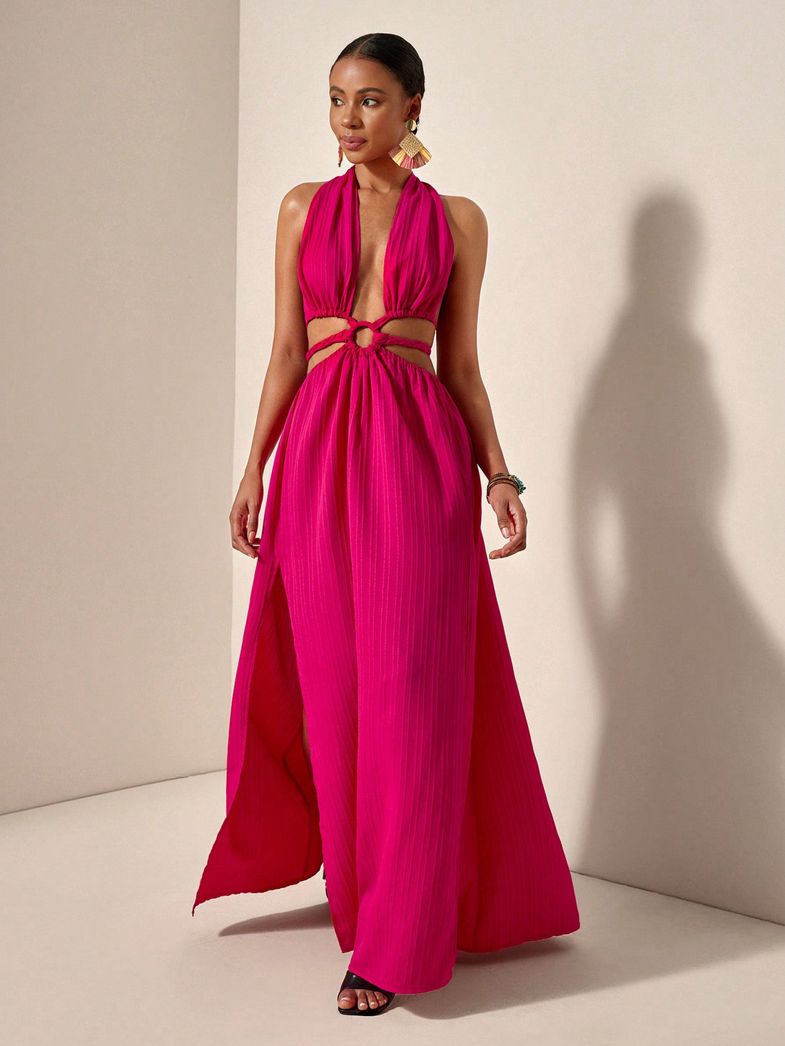 Get ready to turn heads in this chic and playful halter neck maxi dress! With a stunning backless design and high slits, this dress is perfect for any spring or summer holiday. Stand out from the crowd and embrace your unique style with this must-have dress!