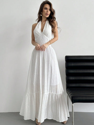 Turn heads this season in our stunning halter neck plaid dress, where timeless pattern meets modern flair. The flattering halter design frames your shoulders beautifully, while the playful ruffle hemline adds movement and charm to every step. Crafted in crisp white, this versatile piece transitions effortlessly from graduation celebrations to summer dates and beyond. Whether you're dressing up for a special occasion or elevating your everyday style, this dress delivers that perfect balance of sophistication