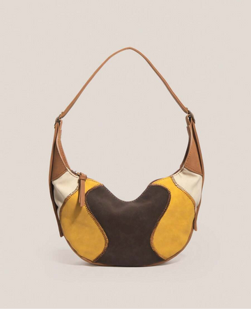 Carry your essentials in style with the Chic Handmade Bologna Patchwork Tote Bag! This crescent-shaped beauty boasts a spacious interior perfect for work, shopping, or your next adventure. Its unique patchwork design adds a playful touch to any outfit, while the roomy capacity keeps everything organized on the go. Whether you're commuting or exploring, this tote is your new favorite companion for a chic, hands-free day out.