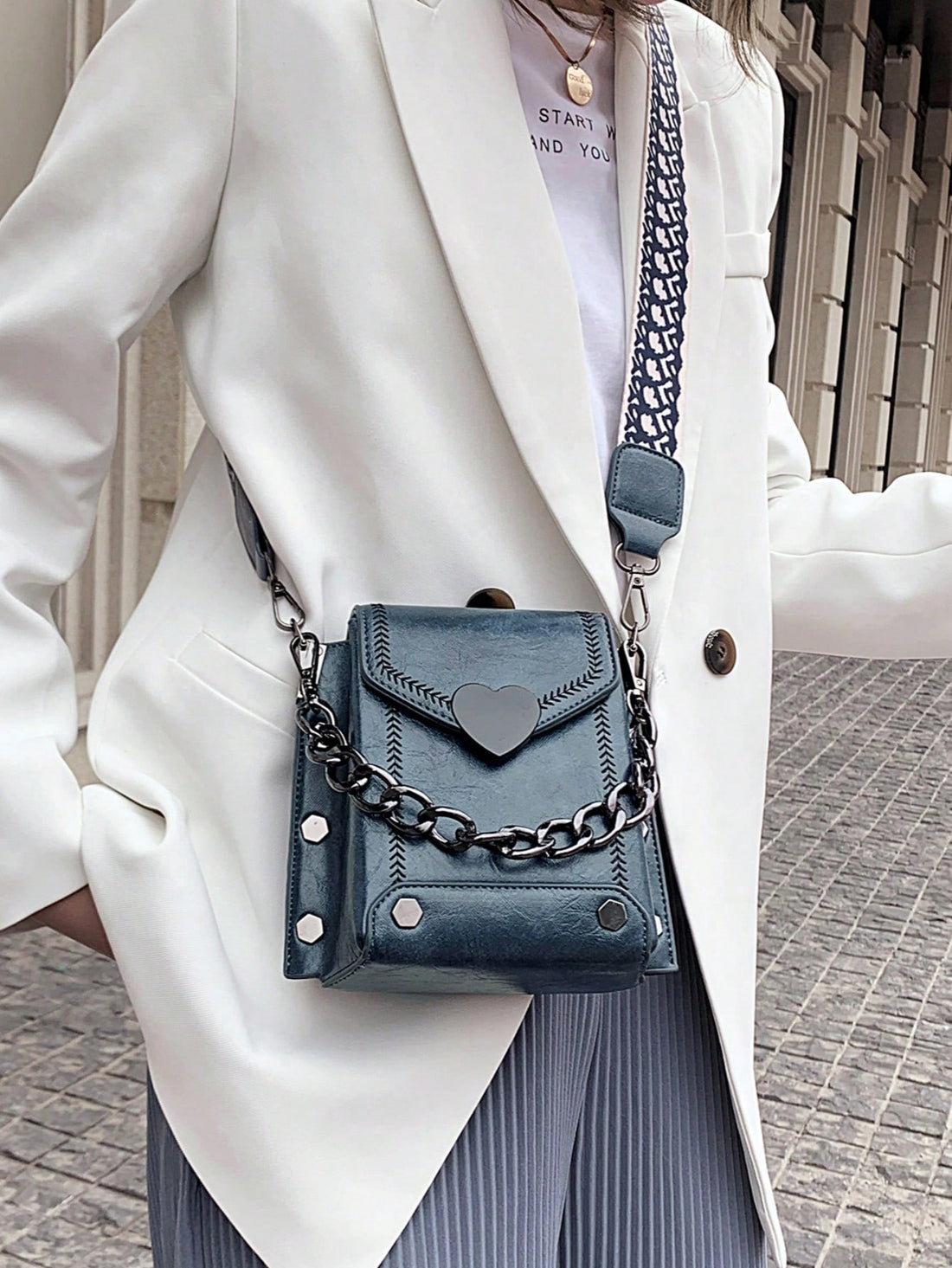 This chic heart-shaped mini square bag is the perfect accessory for both casual outings and stylish events. Its thick chain strap adds a touch of luxury while its compact size makes it convenient to carry. Elevate your outfit with this trendy and versatile bag.