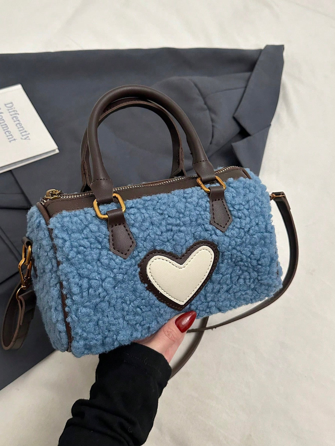 Elevate your autumn and winter style with our Chic Heart Plush Handbag. This stylish accessory features a unique heart-shaped design and plush material, perfect for adding a touch of luxury to your outfit. Stay fashion-forward and cozy all season long.