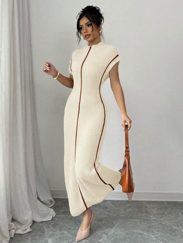 Step into cozy elegance with this chic high-neck sleeveless long sweater dress. Designed to keep you warm without sacrificing style, it’s your go-to for layering this fall and winter. Flowy and flattering, it moves with you while making chilly days feel effortlessly fashionable. Pair it with boots or your favorite jacket and get ready to turn heads wherever you go!