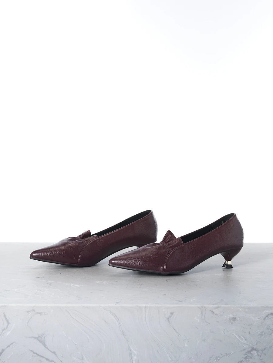 Elevate your professional wardrobe with these sophisticated pointed-toe pumps. Crafted from premium PU leather with a sleek burgundy finish, they deliver timeless elegance for the office and beyond. The low heel provides all-day comfort while maintaining a polished silhouette perfect for business casual settings. True-to-size fit ensures a seamless experience. Whether you're heading to work, special occasions, or seasonal celebrations, these versatile court pumps transition effortlessly from spring through 