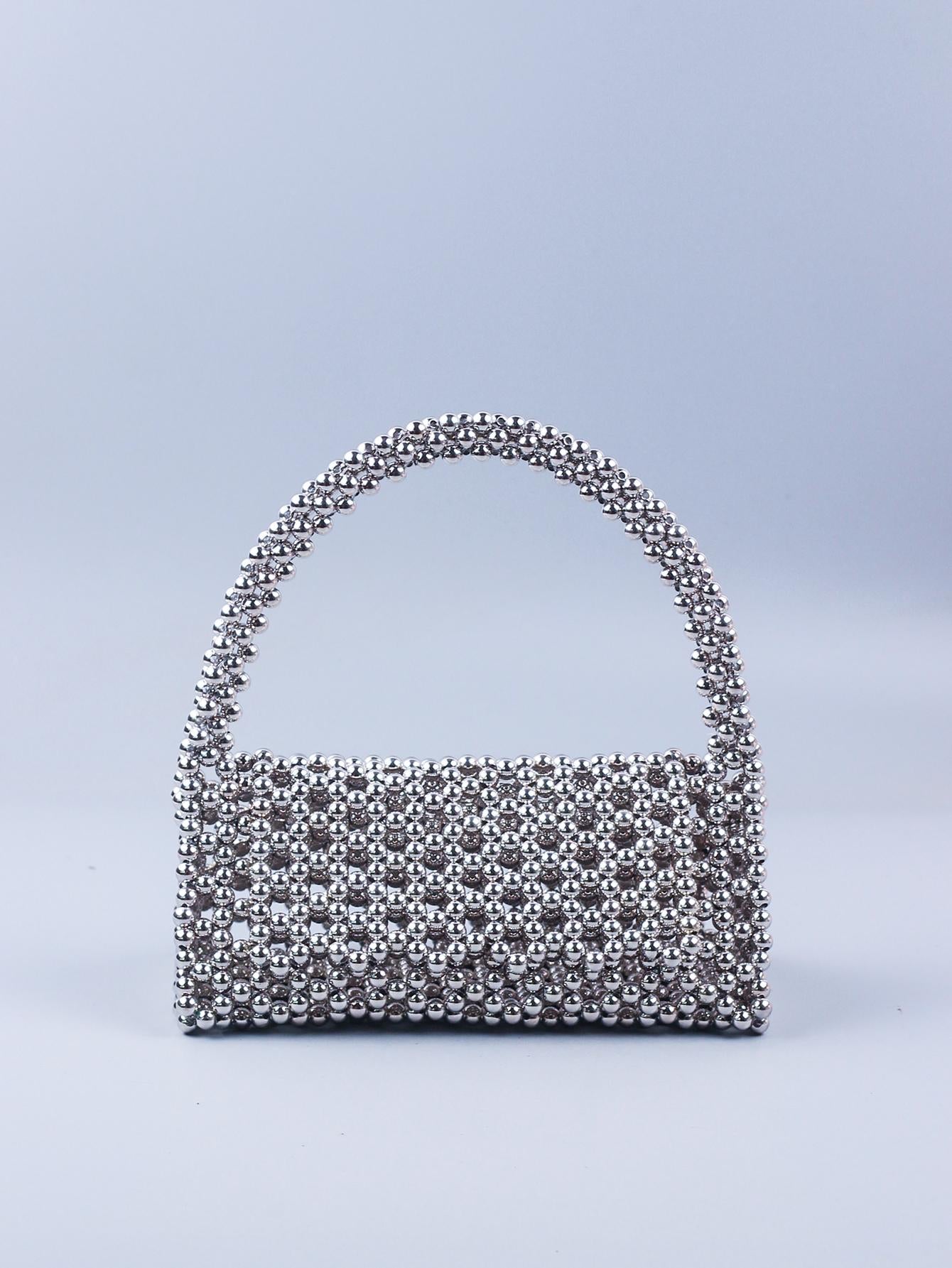 Upgrade your beach, sports, or picnic game with our Chic Hollow Out Beaded Transparent Tote Bag! Stay stylish while keeping your belongings dry and free from sand with our waterproof and sandproof design. Plus, the chic and unique hollow out beaded details add a touch of glam to any outfit. Get ready to turn heads and make a statement with this must-have bag!