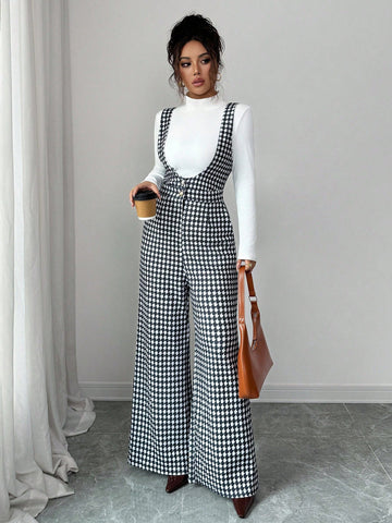 Elevate your fall wardrobe with this chic houndstooth jumpsuit set that screams effortless sophistication. The classic wide-leg silhouette pairs perfectly with a cozy turtleneck for those crisp autumn days when you want to look put-together without trying too hard. The timeless houndstooth pattern adds a playful twist to your everyday style, making it ideal for everything from casual outings to weekend brunches. Comfortable, versatile, and undeniably stylish—this is the one-piece wonder that'll become your 