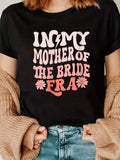 Embrace your motherly charm with our Chic 'In My Mother of the Bride Era' V-Neck T-Shirt. Perfect for proud moms, this shirt celebrates your special role in your daughter's wedding day. Comfortable and stylish, it's a must-have for any mother of the bride!