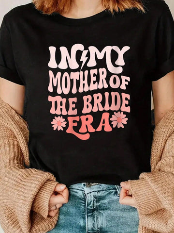 Embrace your motherly charm with our Chic 'In My Mother of the Bride Era' V-Neck T-Shirt. Perfect for proud moms, this shirt celebrates your special role in your daughter's wedding day. Comfortable and stylish, it's a must-have for any mother of the bride!
