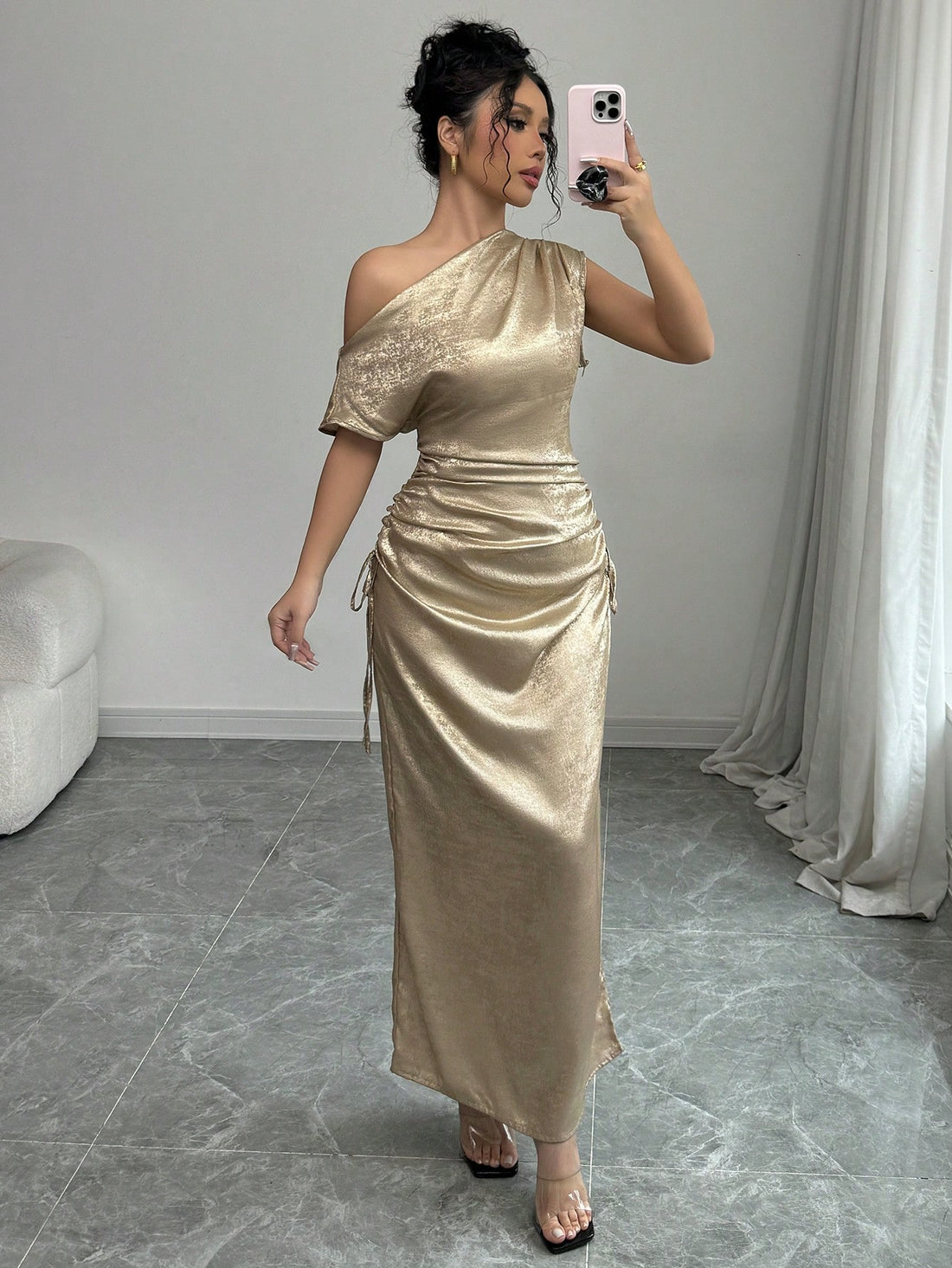 Elevate your elegant style with our Chic Iridescent Cinched Waist Asymmetric Neck Dress. The cinched waist flatters your figure, while the asymmetric neck adds a touch of uniqueness. Made for the stylish woman, this dress is perfect for any event and will make you stand out in a crowd!