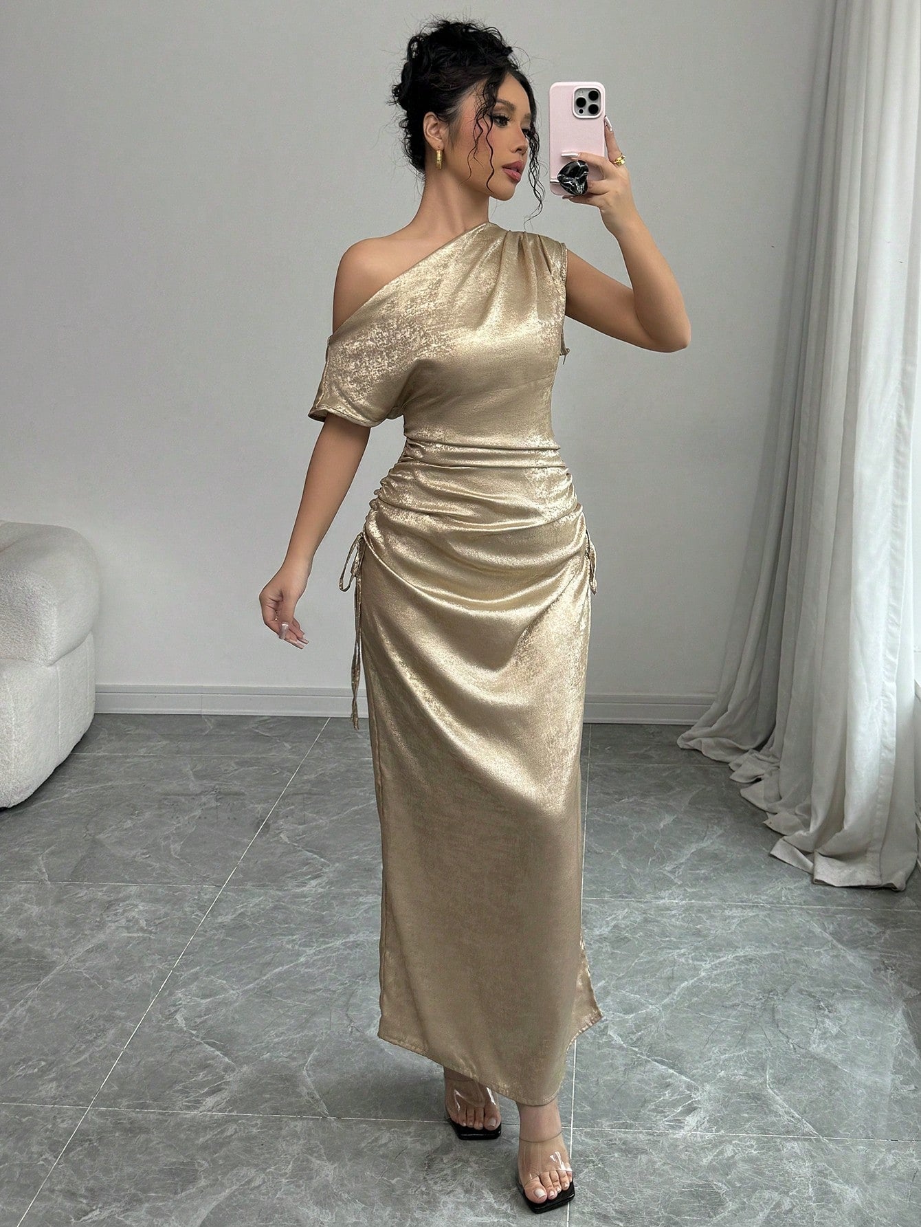 Elevate your elegant style with our Chic Iridescent Cinched Waist Asymmetric Neck Dress. The cinched waist flatters your figure, while the asymmetric neck adds a touch of uniqueness. Made for the stylish woman, this dress is perfect for any event and will make you stand out in a crowd!