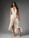 Full-length front view of ivory satin halter dress with deep plunge, long fringe and draped skirt panels