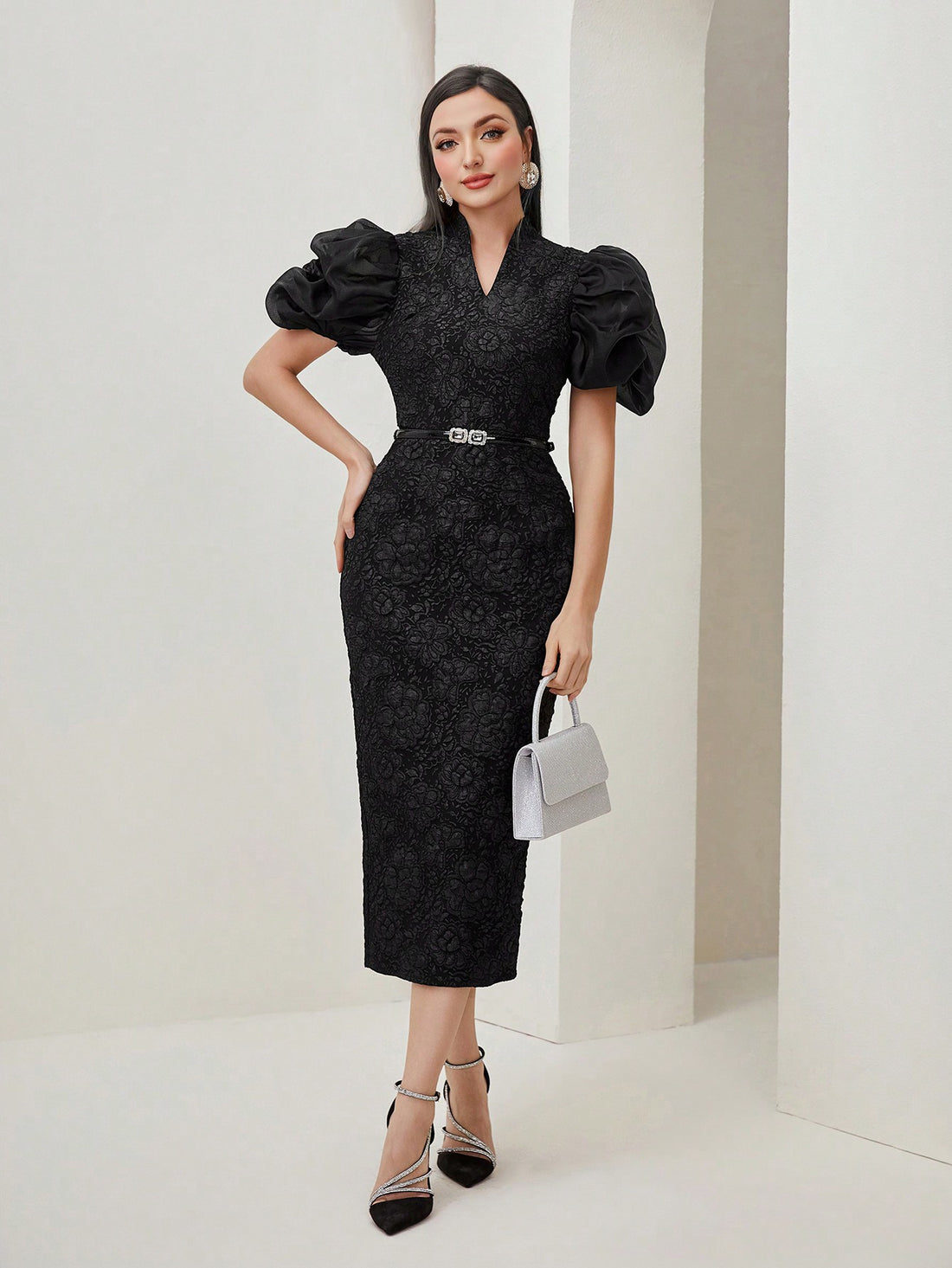 This stunning dress features a chic jacquard design and a fitted silhouette, highlighting your curves. The puff sleeves add a touch of playful elegance, while the stylish split back adds a modern twist. Elevate your wardrobe with this sophisticated and versatile piece.