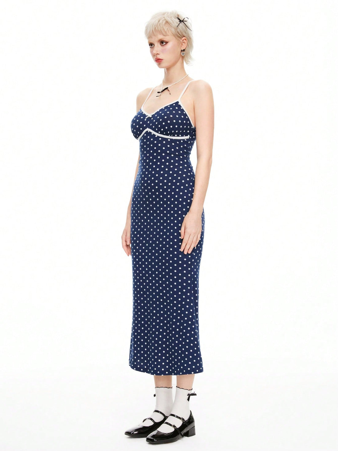 Twirl into your day with this adorable polka dot spaghetti strap dress that's equal parts cute and chic. The delicate spaghetti straps and playful dot pattern create a kawaii-inspired look that's perfect for casual outings, coffee dates, or whenever you want to feel effortlessly put-together. Lightweight and comfortable, this dress transitions seamlessly from day to night, making it a wardrobe essential for anyone who loves a touch of whimsy with their style.