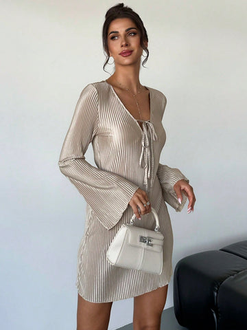 Introducing our effortless elegance Chic Khaki Lace-Up Flared Sleeve Mini Dress! With its lace-up detailing and flared sleeves, this dress adds a touch of chic to any occasion. Perfect for those looking for a unique and stylish outfit, this dress will have you turning heads and feeling confident.