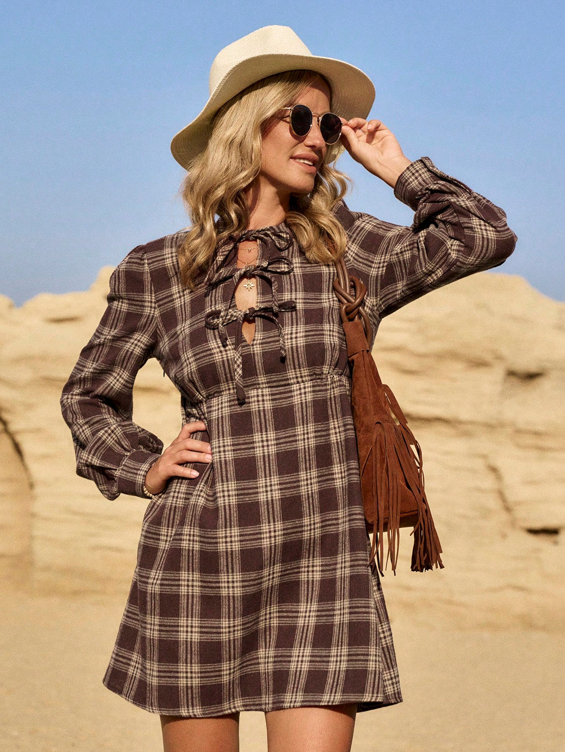 Be the statement at any event with this chic khaki plaid midi dress. The classic plaid print is elevated with modern details like a midi length and long sleeves. You'll be both stylish and comfortable in this fashion-forward dress.