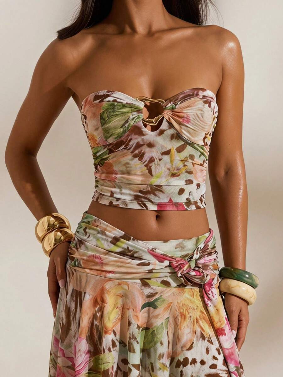 Front studio view of multicolor tropical print mesh bandeau crop top and flowing high-slit maxi skirt two-piece set for beach vacation styling