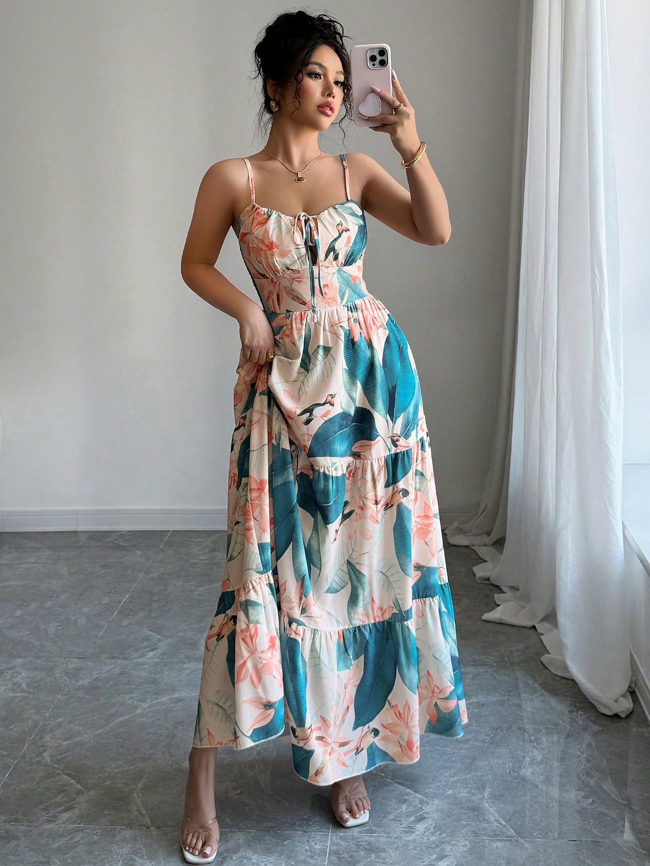 Embrace your inner free spirit with this stunning leaf print maxi dress that's basically summer in fabric form. The delicate spaghetti straps keep things breezy and effortless, while the flowing silhouette glides beautifully with every step. Perfect for lazy beach days, garden parties, or whenever you want to look put-together without actually trying. The botanical print adds just the right touch of nature-inspired charm to elevate your warm-weather wardrobe. Slip it on and let the good vibes follow.
