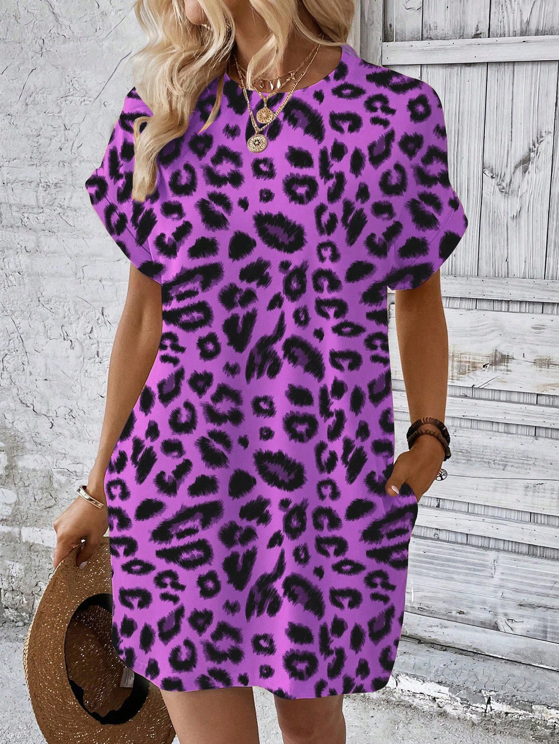Get ready to turn heads in this playful and versatile leopard print dress! With batwing sleeves and a chic design, this dress is perfect for any occasion. Add a touch of fun to your wardrobe with this stylish piece.
