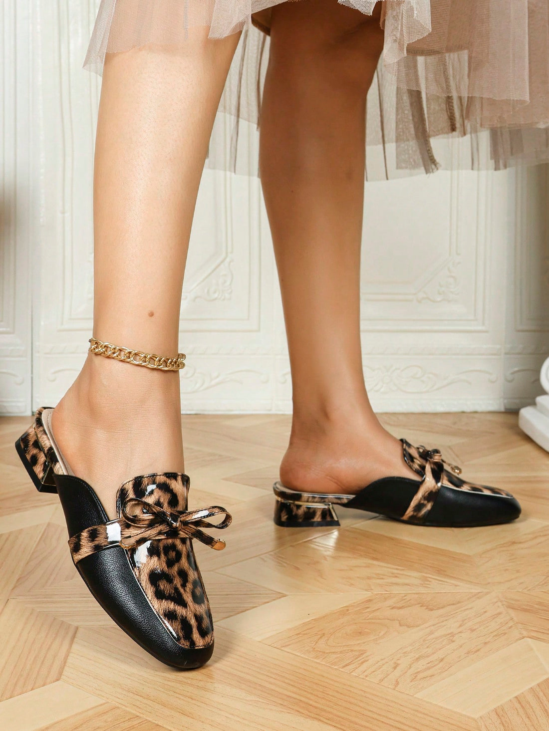 Elevate your casual wardrobe with these chic leopard print chunky heel mules featuring a sleek metal buckle. Designed for both style and comfort, they offer sturdy support without compromising on fashion. Perfect for adding a bold, sophisticated touch to everyday outfits, these mules effortlessly blend trend-forward design with practical wearability.