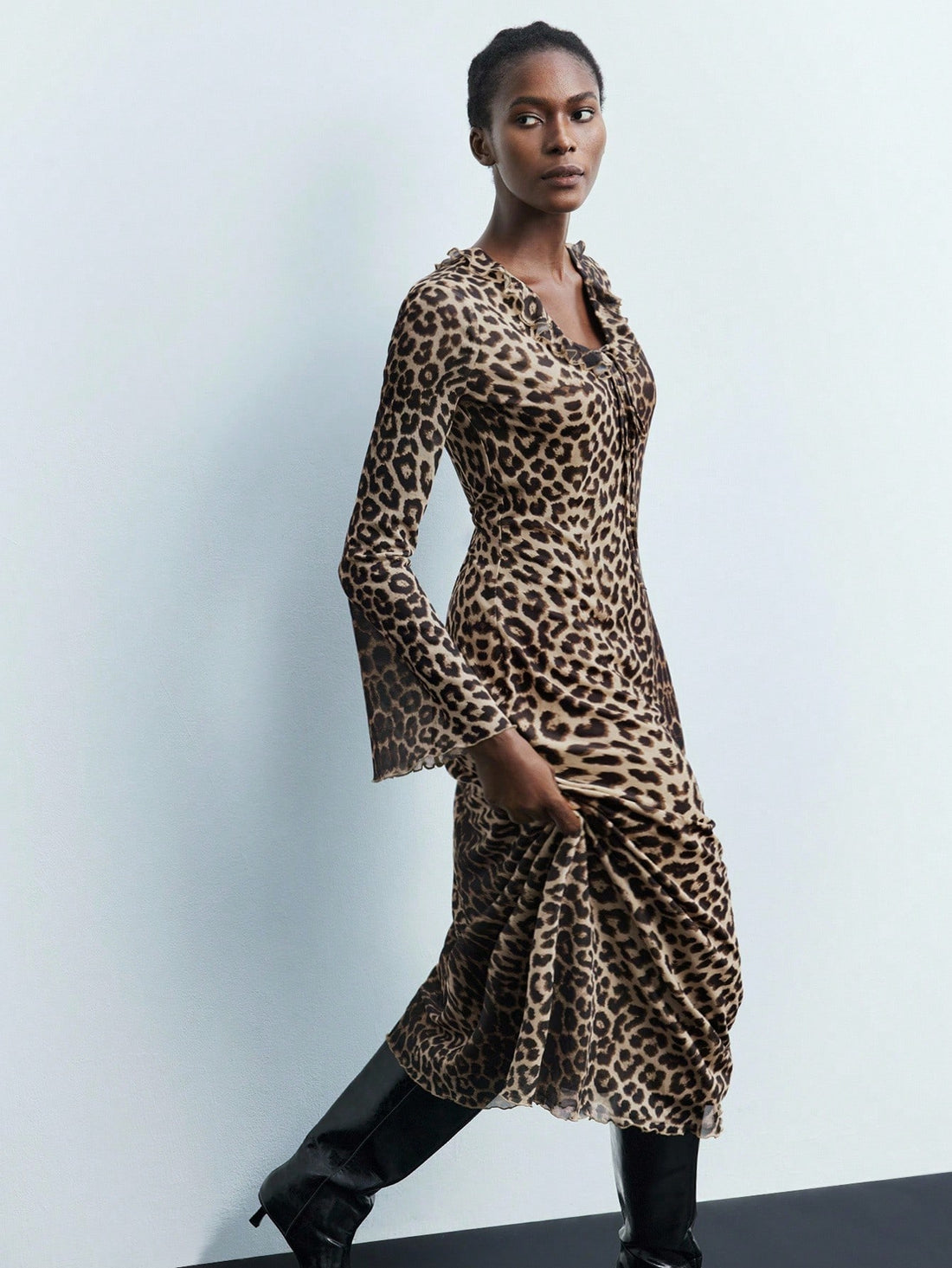 Step out in style with this Chic Leopard Print Flare Sleeve Dress, designed to turn heads on your fall commute. Its playful flare sleeves add a touch of fun, while the bold leopard print keeps your look fierce and fresh. Perfect for transitioning from work to weekend, this dress blends comfort and confidence effortlessly.