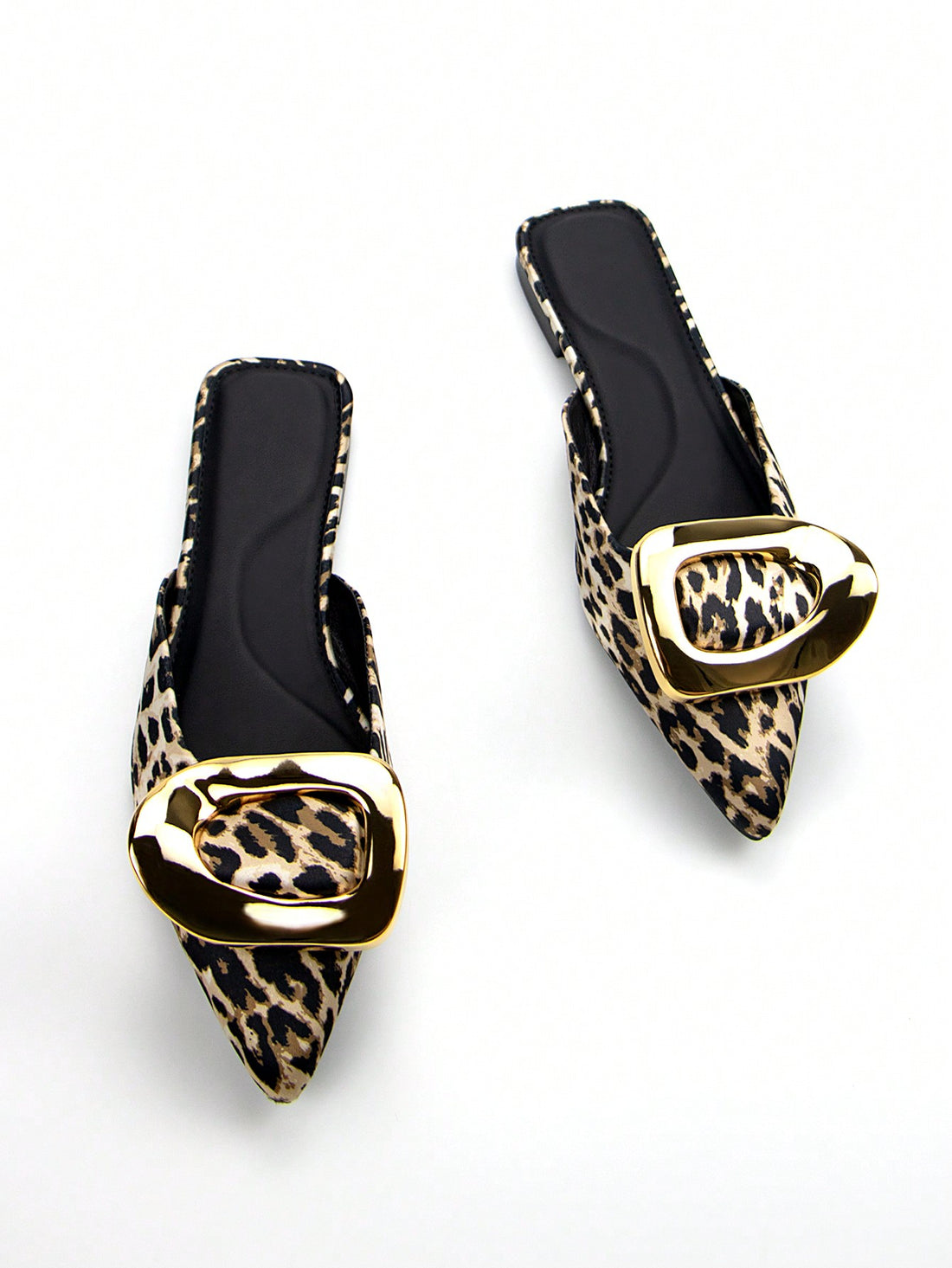 Effortlessly elevate your daily style with our Chic Leopard Print Flat Mules. These elegant flats feature a striking floral patchwork design, bold leopard print, and gold hardware for a touch of luxury. With a comfortable flat heel and trendy metal buckle, these mules are the perfect way to add a touch of sophistication to any outfit.