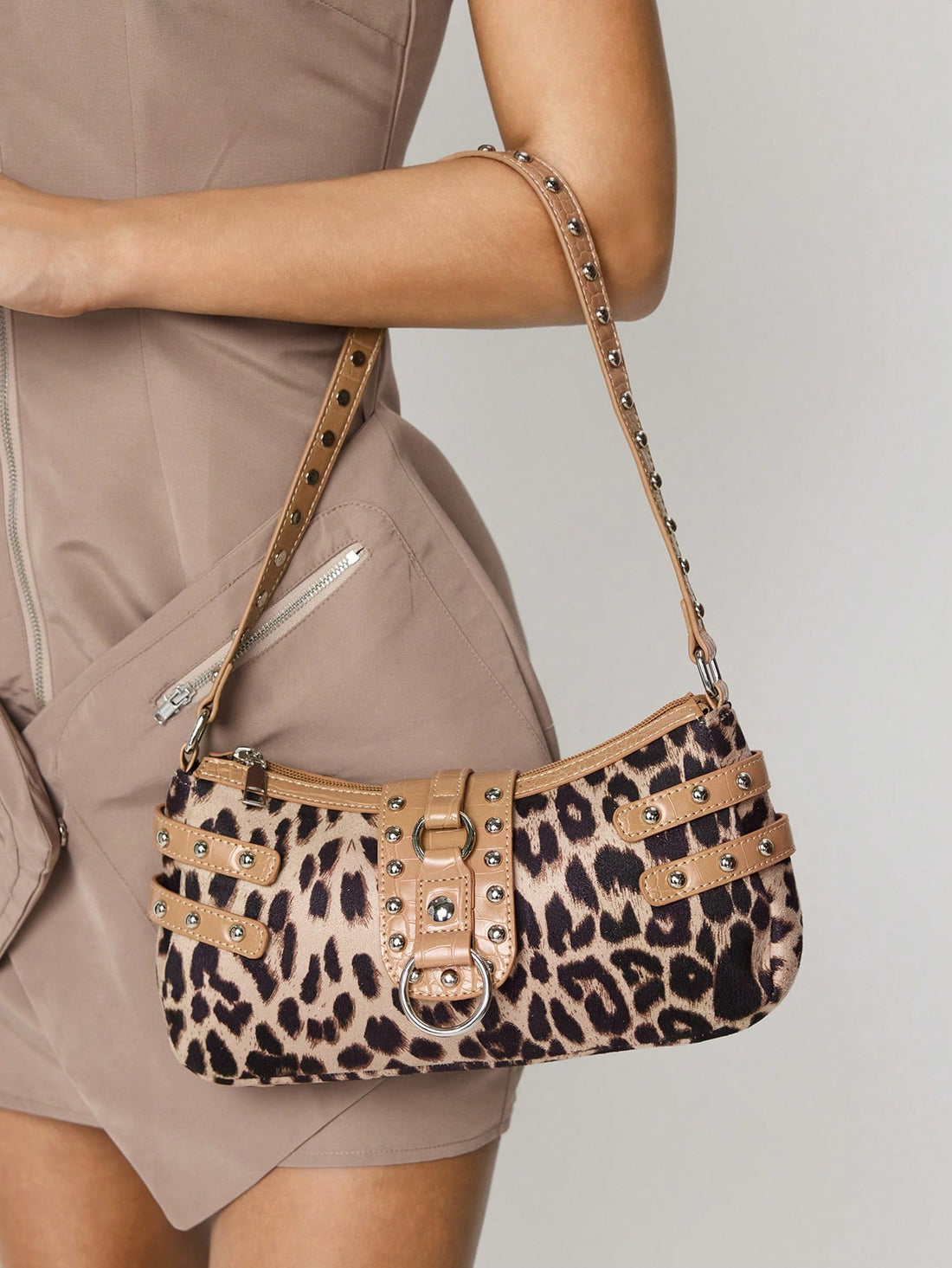 Add a wild touch to your daily style with this chic leopard print hobo bag. Crafted from soft suede, it’s perfect for the office, your daily commute, or casual hangouts. Spacious yet stylish, it holds all your essentials while turning heads wherever you go. Embrace effortless elegance with a playful edge!
