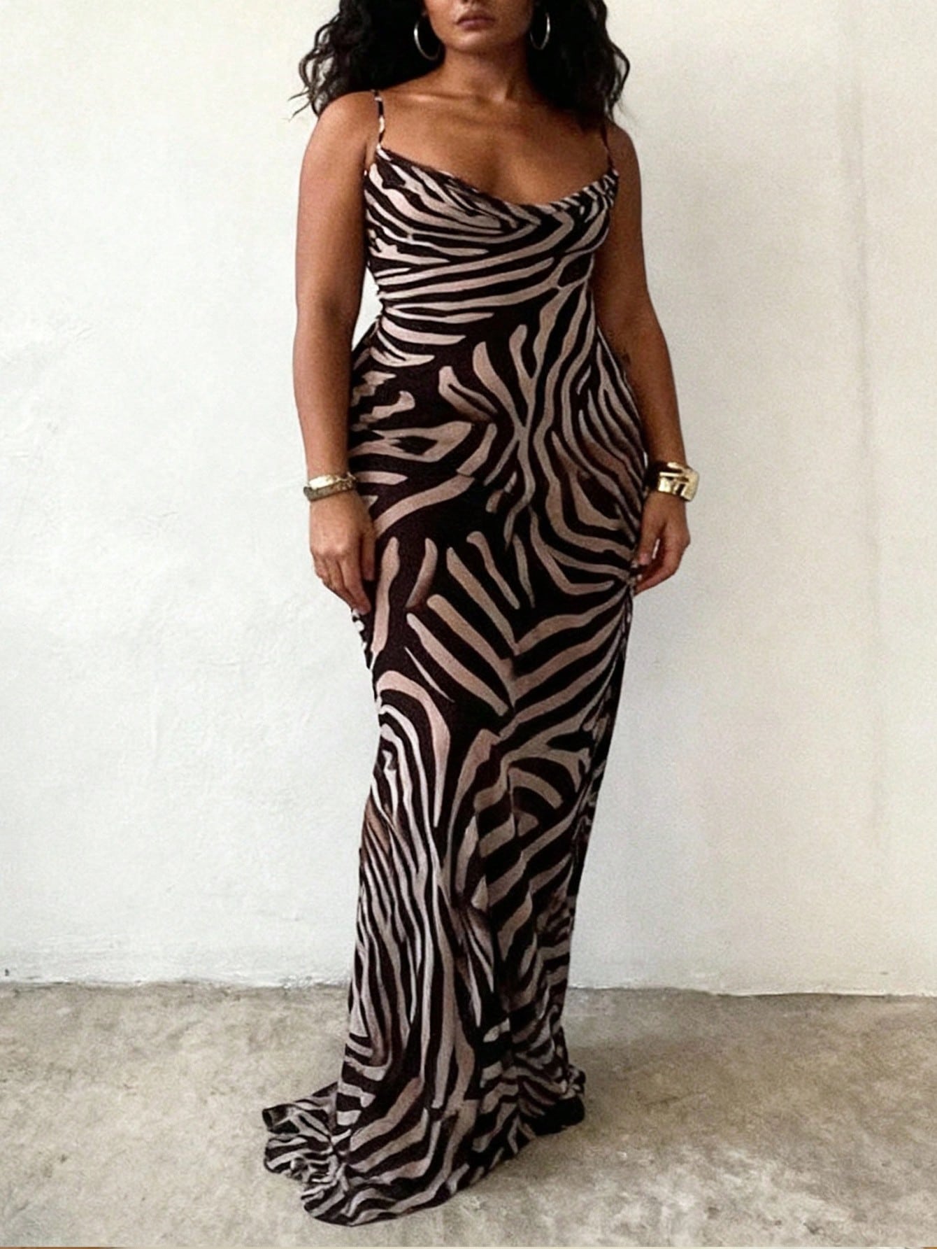 Unleash your wild side with this stunning leopard print maxi dress that's equal parts sophisticated and fun. The elegantly draped neckline adds a touch of refinement, while the flowing silhouette flatters every figure. Perfect for vacation getaways or elevating your everyday wardrobe, this versatile piece transitions seamlessly from beach days to dinner dates. The timeless leopard pattern never goes out of style, making it a go-to favorite you'll reach for again and again. Comfortable, chic, and undeniably 