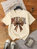 Stay stylish and comfy in our Chic Leopard Print Mom T-Shirt with Retro Bow Design for Women. The playful retro bow design adds a touch of fun to this trendy leopard print shirt. Perfect for all the cool moms out there! (Moms totally rule!)