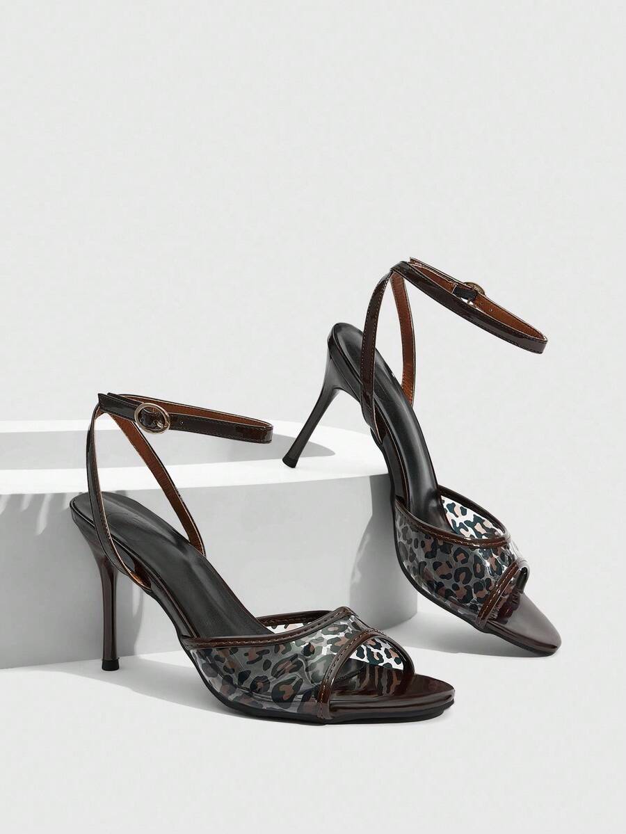 Elevate your Valentine's Day look with these striking leopard print stiletto heels. Featuring an open toe design and sleek stiletto heel, they deliver timeless sophistication with a bold animal print twist. The classic silhouette pairs effortlessly with dresses, skirts, or tailored trousers for an instantly polished appearance. Crafted for the modern woman who appreciates statement footwear, these heels transition seamlessly from evening events to upscale occasions. The precise heel height provides elegant 