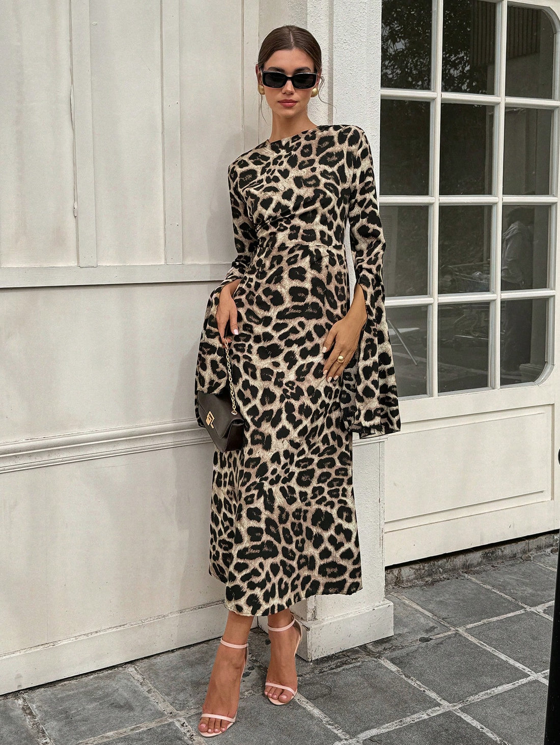 Unleash your wild side with our Chic Leopard Print Ruffle Sleeve Split Dress! This essential party piece features playful ruffled sleeves and a stylish split design, perfect for making a statement at any event. Embrace your inner fashionista and add some elegance to your wardrobe with this unique piece.