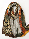 Elevate your style with our Chic Leopard Print Scarf. This versatile shawl offers both breathability and warmth, making it the perfect accessory for any season. Its eye-catching print adds a touch of sophistication to any outfit. Express your unique fashion sense with this must-have scarf.