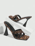 Step out in style with these Chic Leopard Velvet High Heel Mules, featuring a dazzling glitter strap and a trendy square toe design. Perfect for adding a playful touch to any outfit, these sandals combine bold leopard print with sparkling accents to make your look unforgettable. Elevate your wardrobe with comfort and flair in every step.