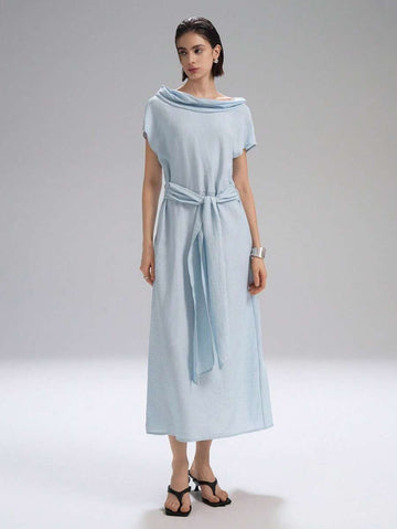 Step into effortless charm with this chic light blue long dress, featuring playful cap sleeves and a stylish draped neck. Perfect for vacation strolls or countryside escapes, it combines comfort and elegance to keep you feeling fabulous wherever you go.