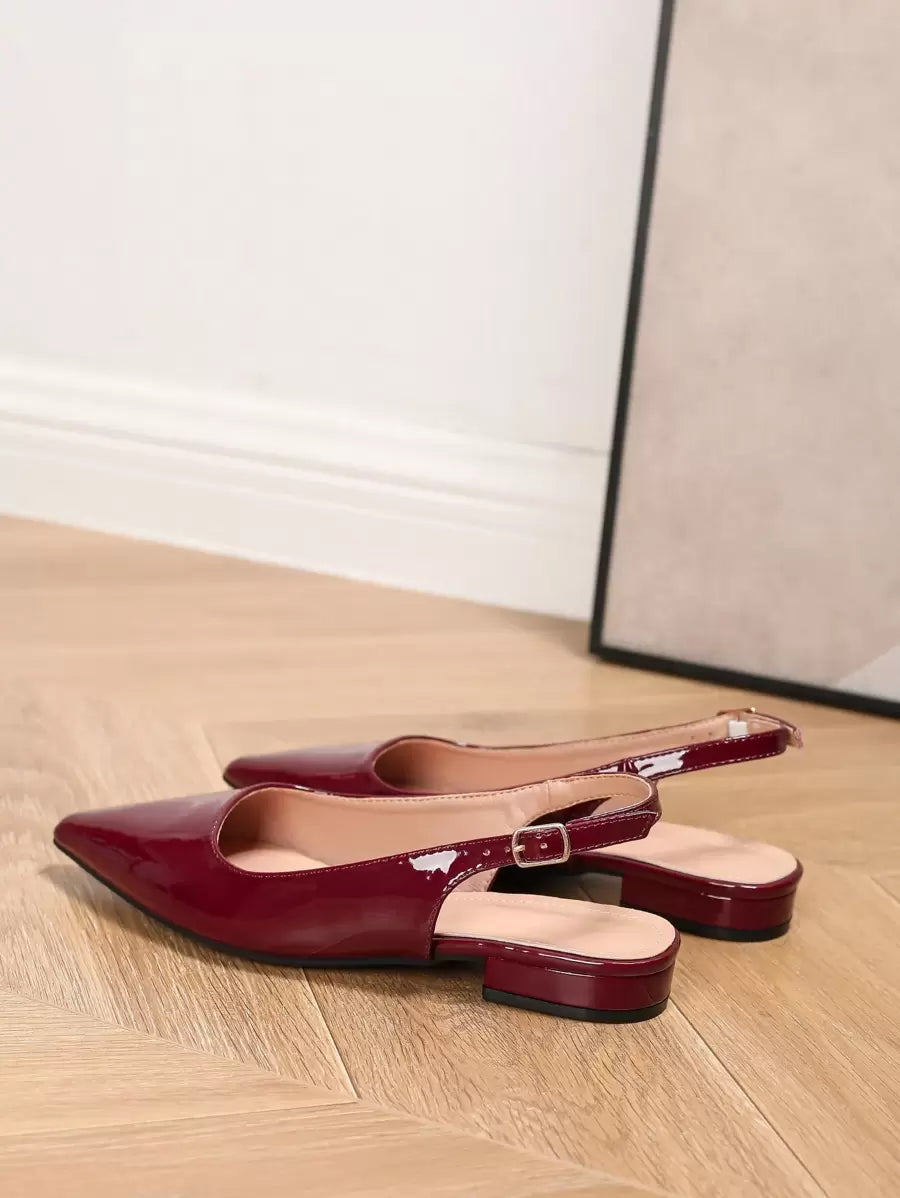 Elevate your evening look with these chic ankle strap heels featuring an elegant pointed toe silhouette. Crafted from premium PU leather with a sturdy PVC sole, these glamorous slingbacks offer all-day comfort with their lightweight design. The chunky heel provides stable support, while spiked details add an edgy touch perfect for parties and special occasions. Available in classic black, these versatile shoes transition seamlessly from celebrations to everyday wear. Note: Fits half-size smaller for an opti