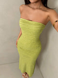 Turn heads in this vibrant lime green tube dress, designed for the modern woman who loves bold style. Featuring a strapless neckline and sleek bodycon silhouette, this midi dress showcases elegant ruffle detailing along the hem for added movement and flair. The mermaid cut flatters your curves while the slim fit keeps everything in place. Crafted from a soft knitted fabric blend with medium stretch, it's comfortable enough for all-day wear yet sophisticated enough for special occasions—from beach getaways t