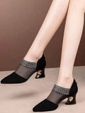 Front view of black pointed toe mesh dress pumps with rhinestone leaf trim
