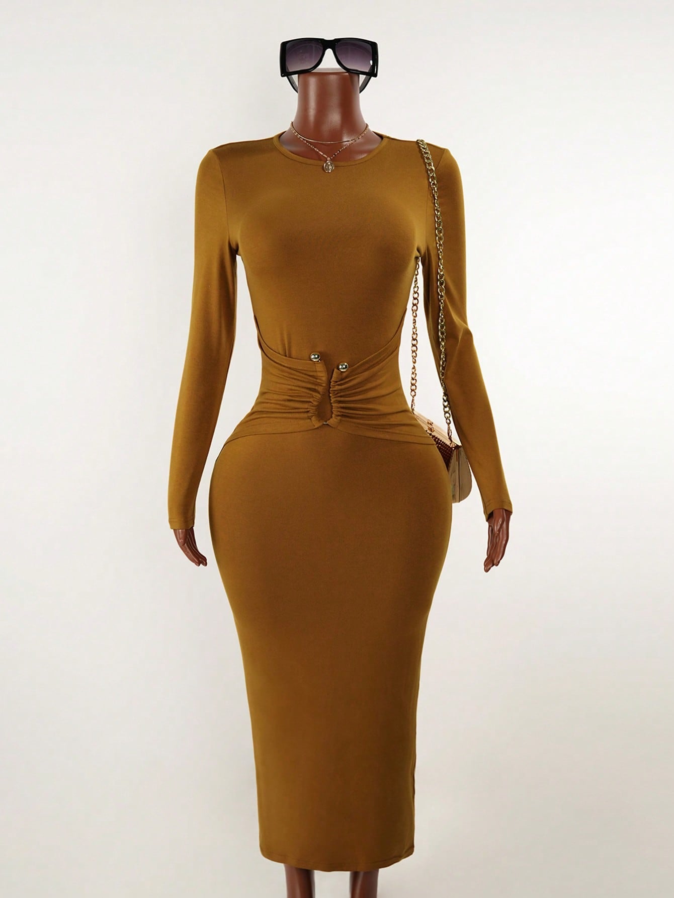 Elevate your everyday wardrobe with this fitted long sleeve dress that strikes the perfect balance between polished and laid-back. The chic metal decor detailing adds just the right amount of sparkle without stealing the show, making it your go-to piece for everything from casual coffee runs to weekend hangouts. The fitted silhouette flatters your figure while the long sleeves keep things cozy and versatile. Dress it up with heels and jewelry or keep it casual with sneakers—this effortless beauty adapts to 