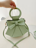 Introducing the Chic Mini Bow Decor Top Ring Bucket Bag, the perfect addition to your wardrobe for any occasion. With its elegant top ring design and chic bow decor, this bag is both stylish and functional. Made with high-quality materials, it's the perfect accessory to elevate any outfit.