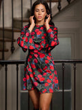 Twirl into the season with this charming mini floral dress that's equal parts romantic and bold. Delicate floral prints dance across the fabric while dramatic flared sleeves add a playful flair that catches every eye. The open tie back creates an effortlessly chic silhouette—perfect for showing off your style while staying cozy through autumn and winter gatherings. Whether you're heading to a festive event or a casual night out, this dress delivers vintage-inspired charm with a modern twist that'll have you
